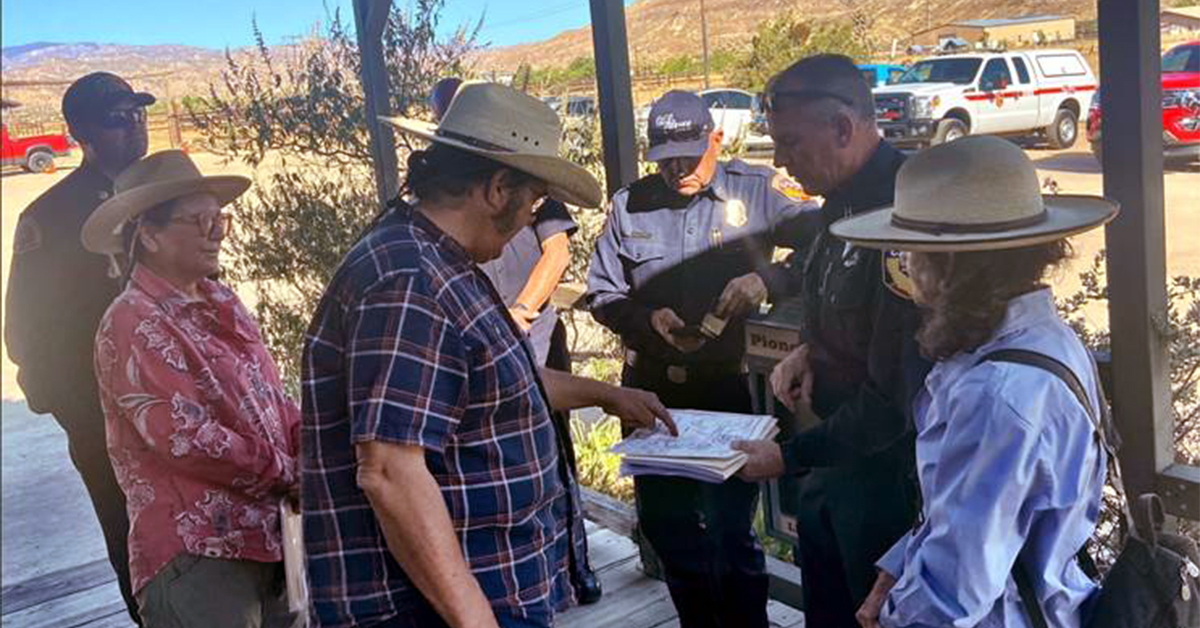 Sarah Kennington met with fire officials from Cal Fire and the San Bernardino Co Fire Dept last Fall to review neighborhood maps for emergency responders as part of a new effort to create a formal Pioneertown Area Firewise Community.